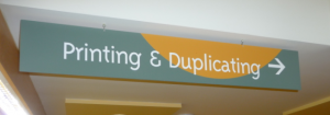 Printing Duplicating Sign by door