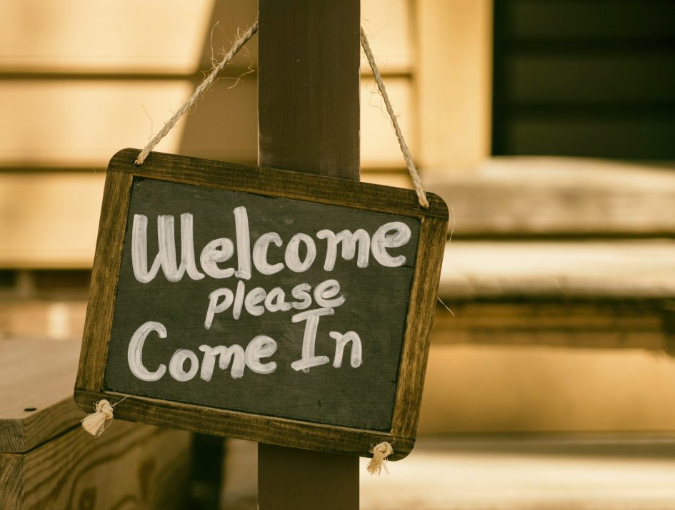 Welcome chalkboard sign: "Welcome, Please Come In"